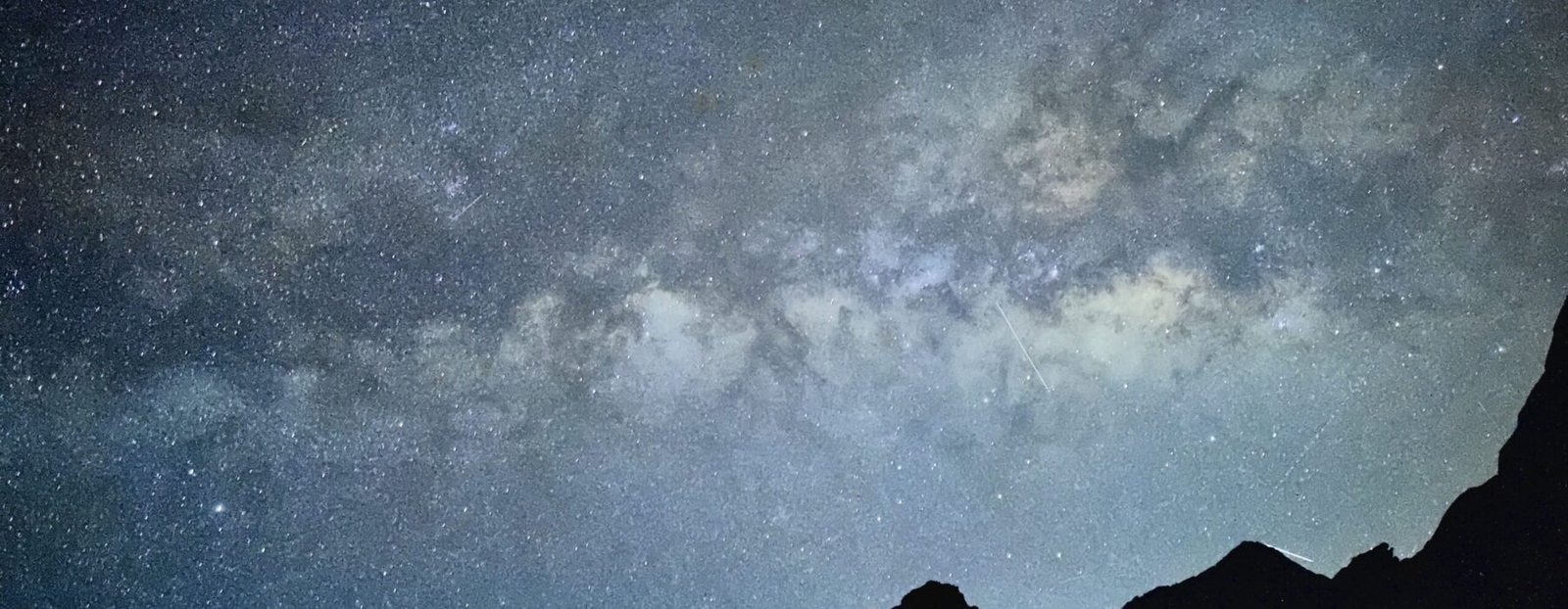 Milky Way above dark Grand Canyon silhouettes
