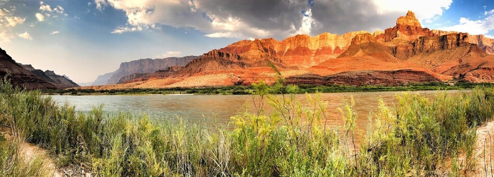Wide panoramic view of the Colorado River winding through the Grand Canyon