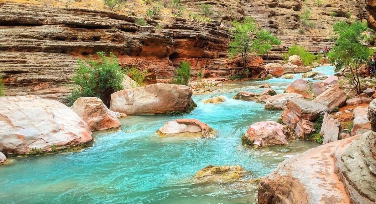 Turquoise Havasu Creek flowing through red rock walls on the Havasupai Reservation
