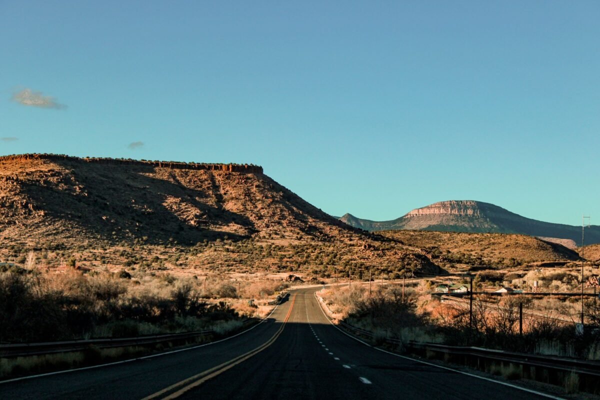 Scenic Arizona road stretching through a red-rock desert landscape