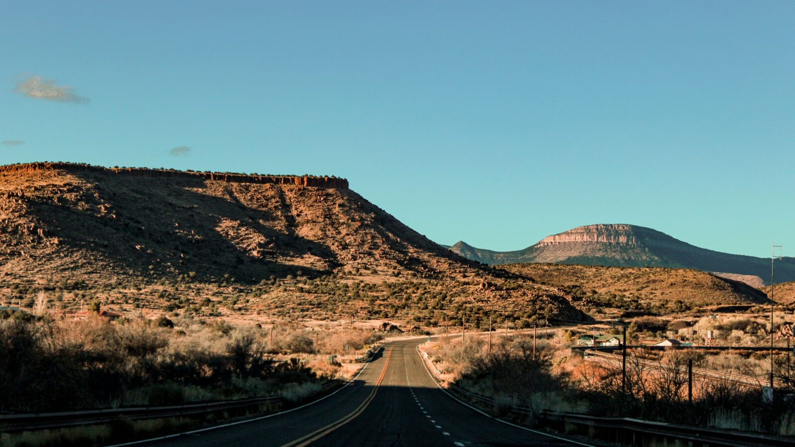 Scenic Arizona road stretching through a red-rock desert landscape