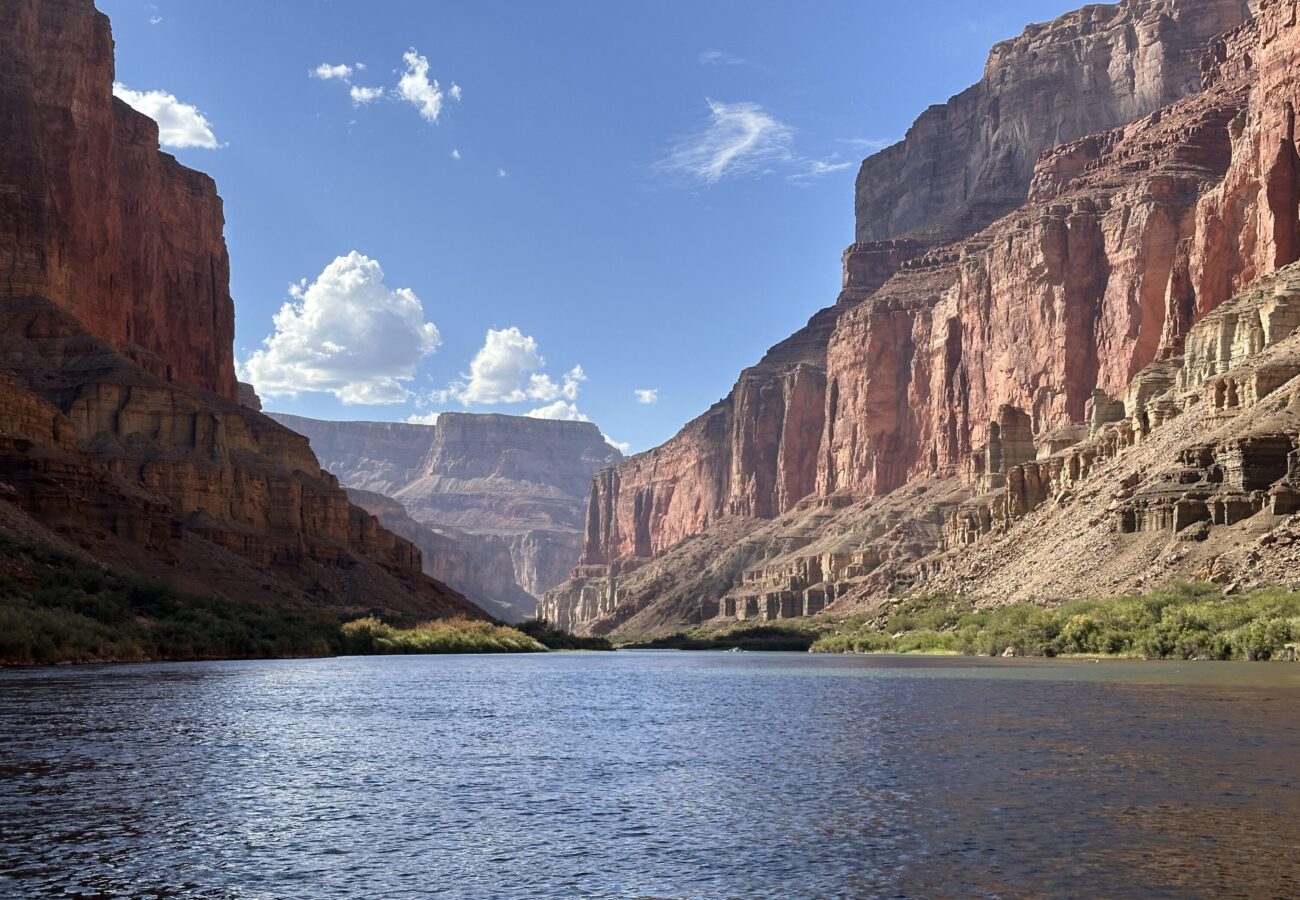 Colorado River stretching between red Grand Canyon cliffs