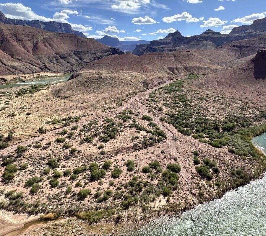 Colorado River winding through the inner Grand Canyon between layered canyon walls