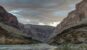Colorado River flowing through the inner Grand Canyon beneath stormy clouds