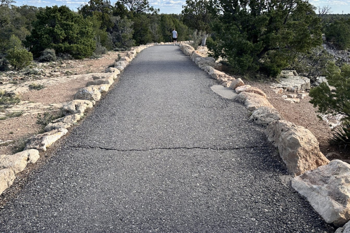 Paved Trail of Time winding along the Grand Canyon South Rim