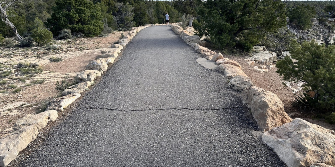 Paved Trail of Time winding along the Grand Canyon South Rim