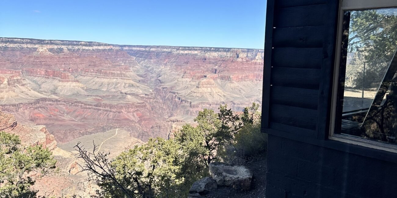 Historic Kolb Studio beside layered Grand Canyon cliffs in Grand Canyon Village