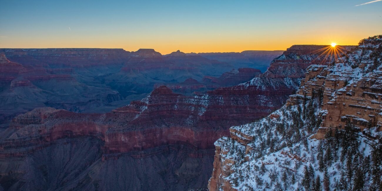Snow-covered cliffs at the Grand Canyon during winter sunrise