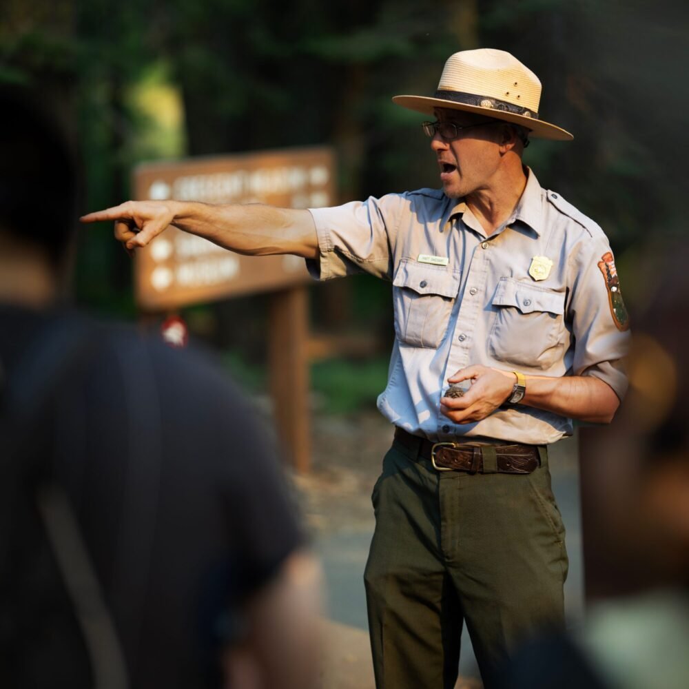 National Park Service ranger speaking to visitors during an outdoor interpretive program