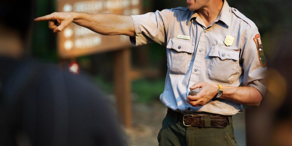 National Park Service ranger speaking to visitors during an outdoor interpretive program
