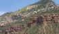 Forested cliffs and layered rock at the Grand Canyon North Rim