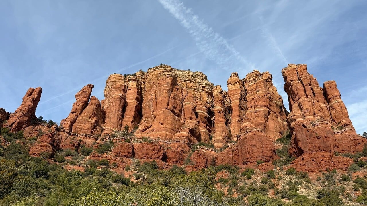 Red sandstone formations and desert vegetation in Sedona, Arizona