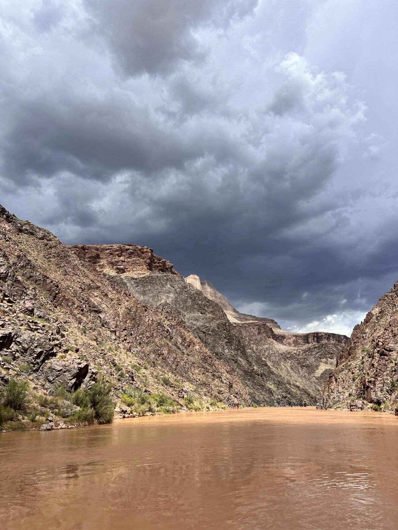 Dark storm clouds above the Colorado River in the Grand Canyon