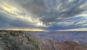 Storm clouds above layered Grand Canyon cliffs