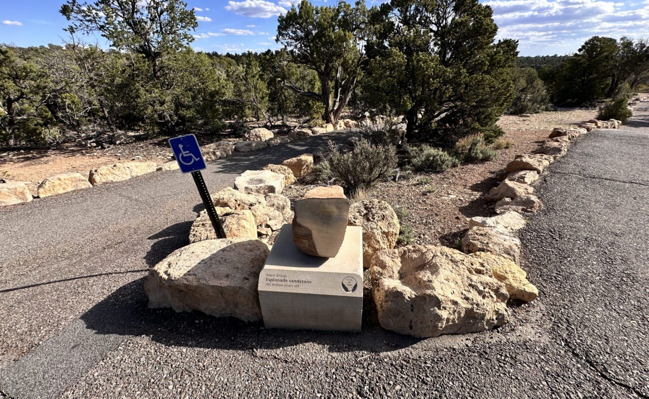 Several labeled rock samples along the Grand Canyon Trail of Time